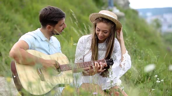 Young Couple In Love On Date Outdoors