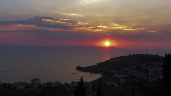 Beautiful sunrise time lapse looking over Turkish coast with Mytilene castle and old port in the for