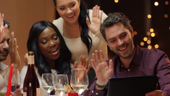 Friends Having Video Call at Christmas Dinner