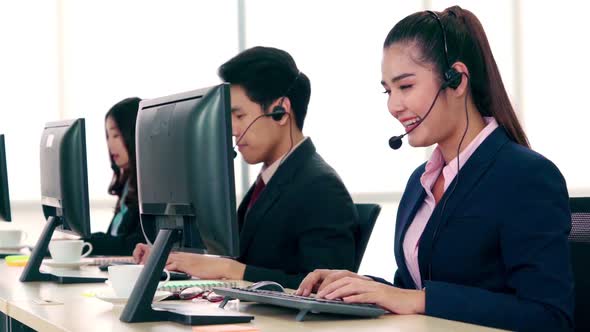 Business People Wearing Headset Working in Office