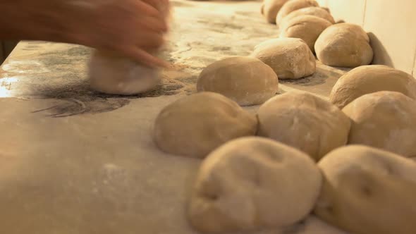 Fast Motion of Male Chef Hands Kneading Dough on Kitchen Table