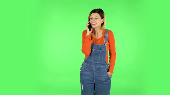 Girl Talking for Mobile Phone, Very Shocked Then Rejoice. Green Screen