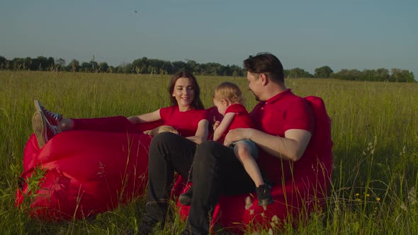 Relaxed Family with Baby Enjoying Summer Nature