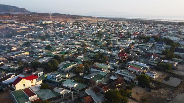 View of typical southern Vietnamese town near Phan Rang. Aerial flying forward