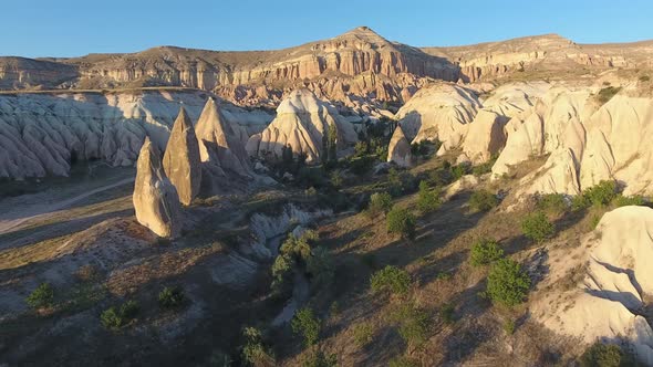 Hoodoos, Fairy Chimneys and Sedimentary Volcanic Rock Formations in Eroded Cappadocia Valley, Turkey