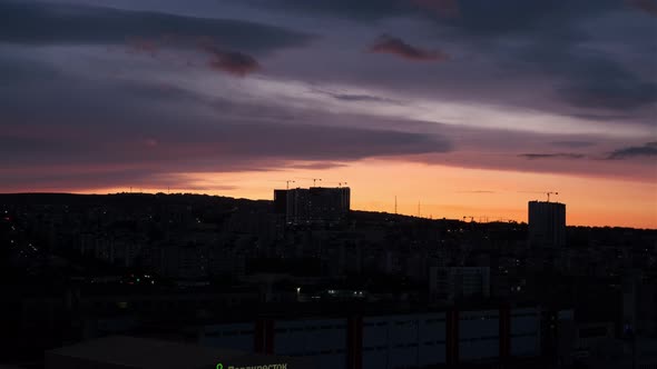 Beautiful Orange Sunset Over Industrial Zone in City Timelapse