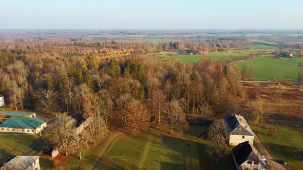 Old Red Brick House, Katvari Manor in Latvia and Katvaru Lake in the Background. View From Above. In