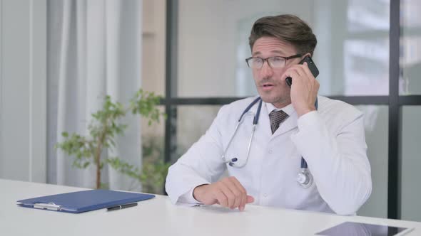 Doctor Talking on Phone in Clinic