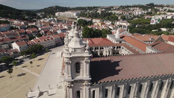 Details front facade of Alcobaca Monastery, gothic and baroque complex of building, aerial pan shot.