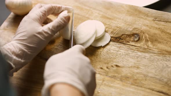 Woman's Hands Pouring Honey and Mustard on Roasted Duck