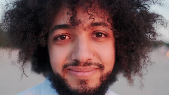 Happy and Overjoyed Mixedrace Man Smiling Satisfied Laughing and Looking in Camera