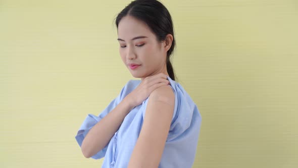 Young Asian Woman Showing COVID19 Vaccine Bandage Merrily