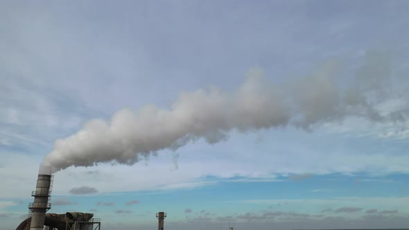 smoke from a factory chimney against the sky