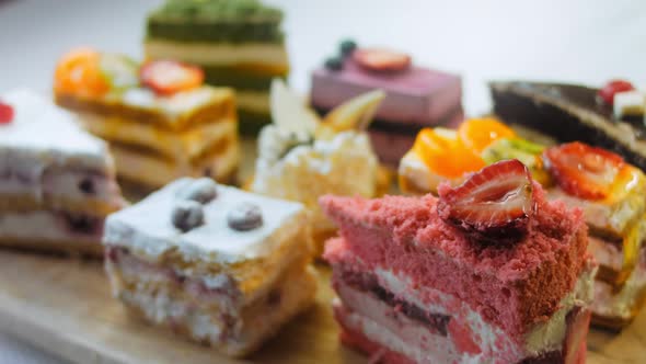 Pieces of Different Cakes on a Retrostyle Baking Tray