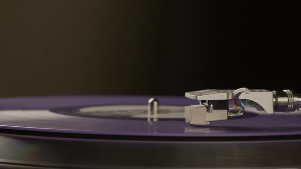 Blue Vinyl Record Spinning on Turntable Isolated on Black