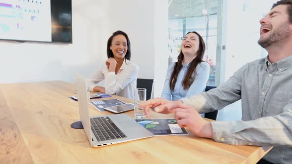 Business colleagues interacting with each other in conference room 4k