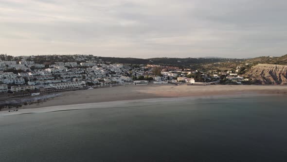 Wide View of Praia da Luz beach at dusk, Algarve, Portugal - Aerial