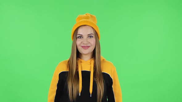 Portrait of Modern Girl in Yellow Hat with Shocked Surprised Wow Face Expression. Green Screen