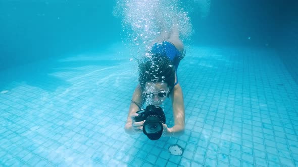 Young Woman Dives Into the Water. View From Under the Water, Spray. Summer Holiday Concept, Jump To