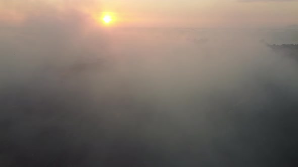 Aerial fly over smoke due to landfill area burning