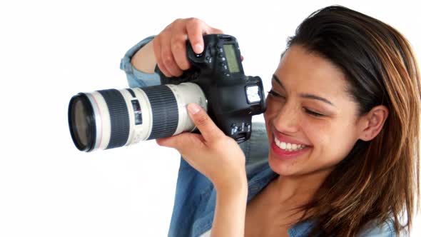 Photographer taking photo with professional digital camera