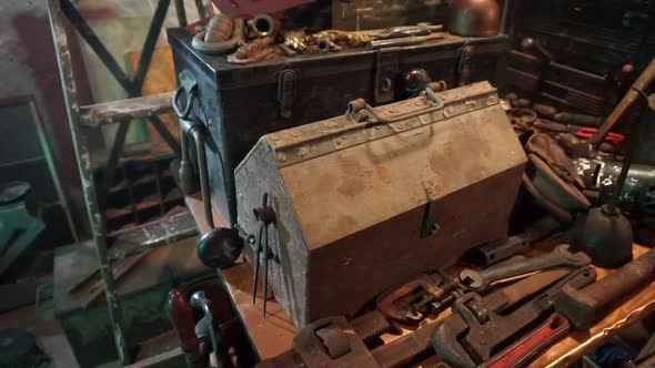 Tracking shot of tools on workbench.