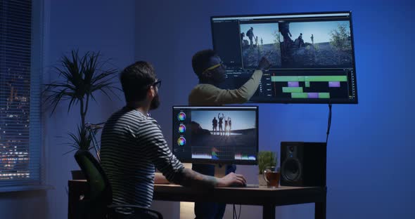 Young Man Editing Video Inside the Room