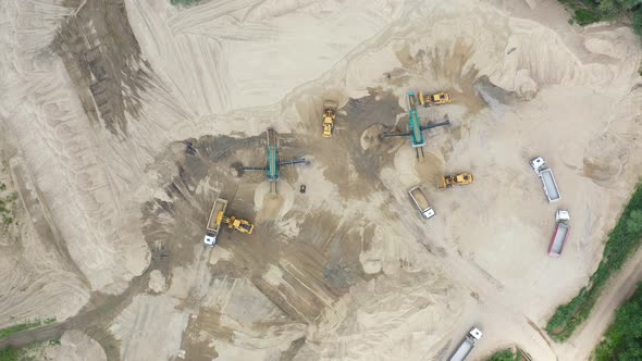 Aerial view loading bulldozer in open air quarry. Sand mining industry. Bulldozer machine. Crawler b