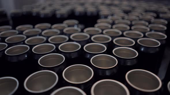 Moving Aluminum Beer Cans On A Conveyor Belt At Brewing Company