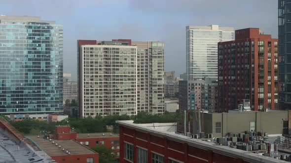 A downtown Chicago time lapse showing waves of light through throngs of fog and rain clouds.