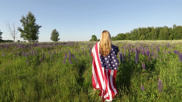 Unrecognizable Woman Wearing American Flag Stands In The Meadow And Mourns Her Soldier Husband