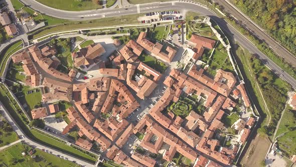 Top Down Aerial View of a Small Historic Town Venzone in Northern Italy with Red Tiled Roofs of Old