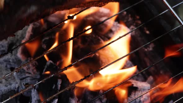 Searing and flipping ribeye steak on grill