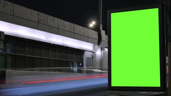 Time Lapse, Billboard with a Green Screen, Located on a Busy Street, Cars Move in the Evening