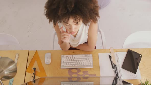 View from above of woman working in creative office