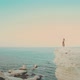 Woman Dancing on Rocks Near Sea - VideoHive Item for Sale