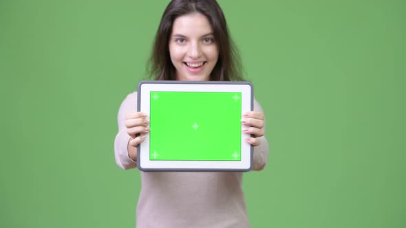 Young Happy Beautiful Woman Showing Digital Tablet