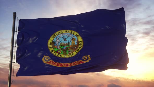 Flag of Idaho Waving in the Wind Against Deep Beautiful Sky at Sunset