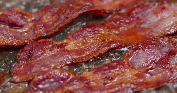 Cook with bacon on fry pan 