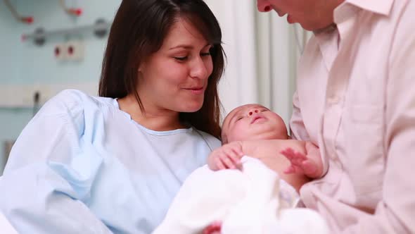 Mother and father with a new born baby