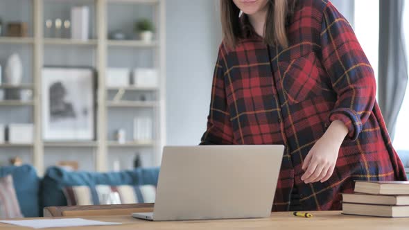 Young Woman Coming To Work on Laptop