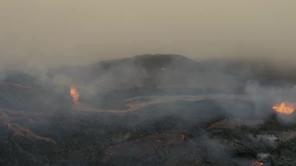 Aerial view of a apocalypse scene after a volcano eruption - reverse, drone shot