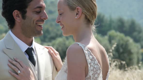 Close up of newlywed couple kissing rural setting