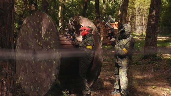 Participating in Leisure Activities Engaging in Outdoor Paintball Games Friends Wearing Camouflage