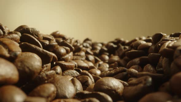 Slow Dolly Out Footage Near Yellow Roasted Coffee Beans Freshly Brewed Coffee Beans Lie on Table