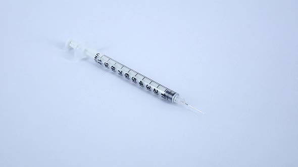 Open Medical Insulin Syringe on White, Rotation