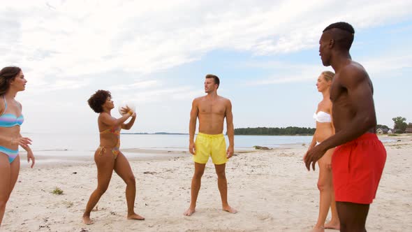 Happy Friends Playing Ball on Summer Beach 1