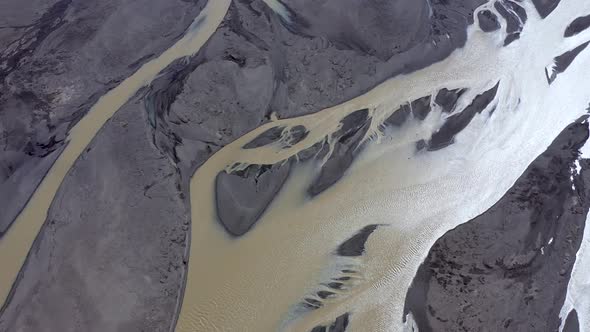 Flying Over a Glacial River and Moraine in Iceland