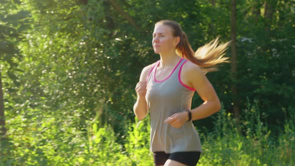 Slow Motion Fit Woman Jogging in the Morning