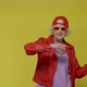 Photo of adorable cute old woman dressed vintage outerwear cap eyewear dancing isolated yellow - VideoHive Item for Sale